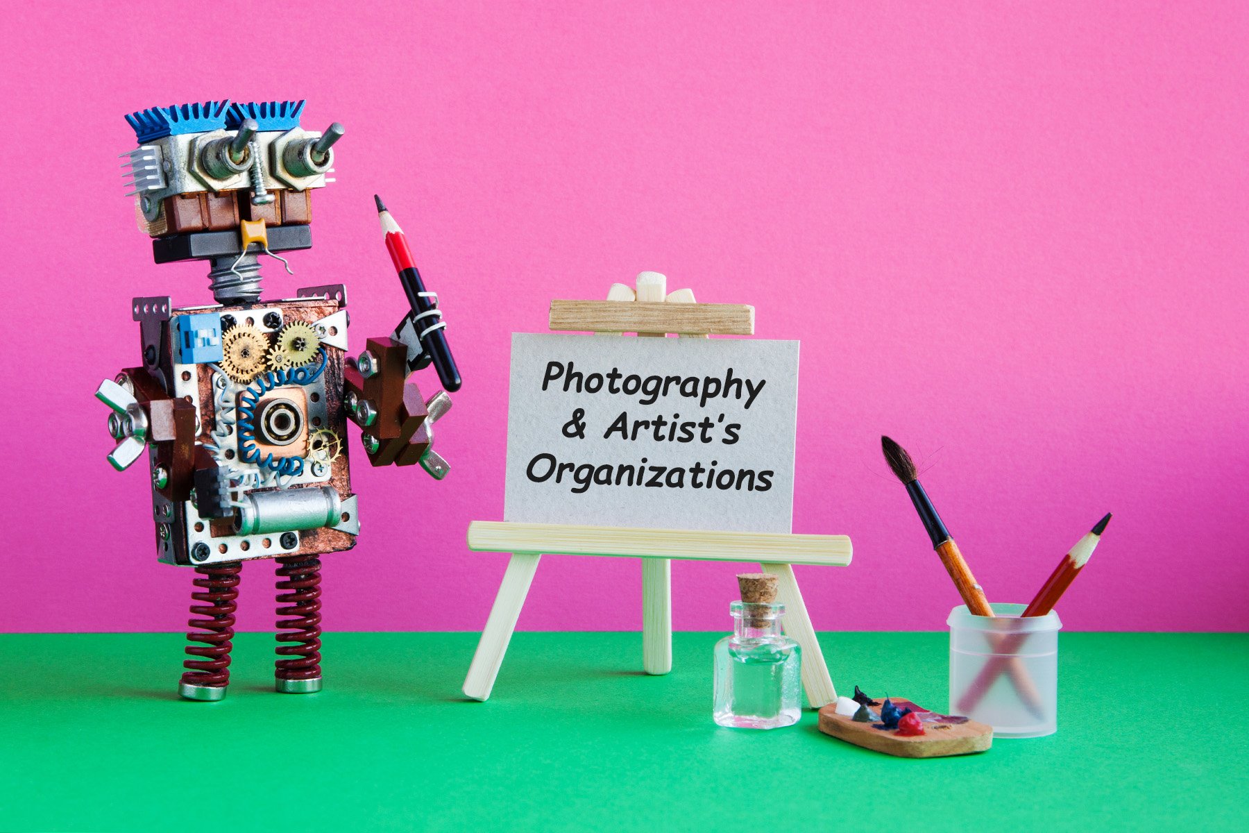 Robot artist with brush paints palette, wooden easel and blank white paper. Advertising poster mockup. Pink background